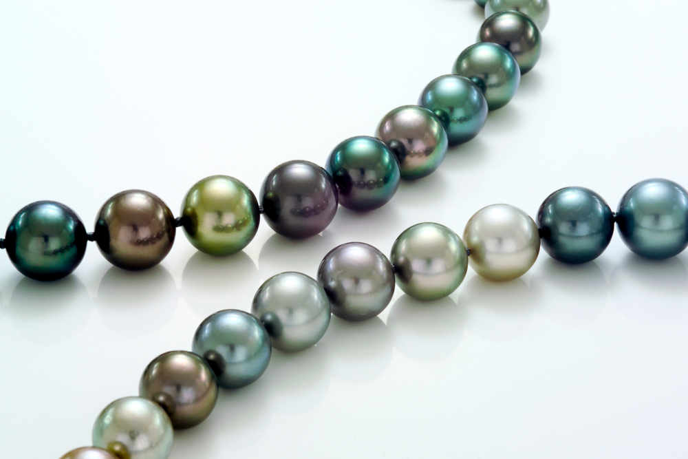 two strands of multi-colored pearls