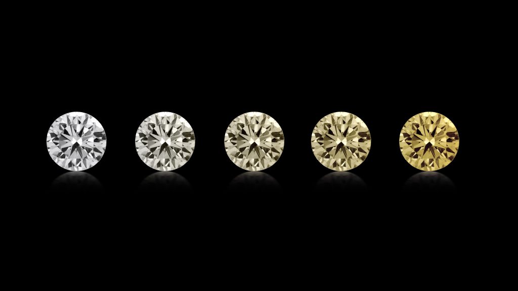 5 diamonds in a spectrum of color from colorless to yellow