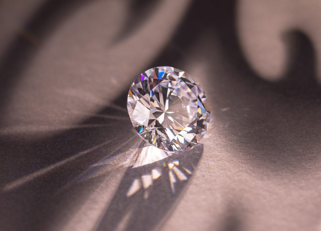 close up shot of a diamond dispersing colored refractions